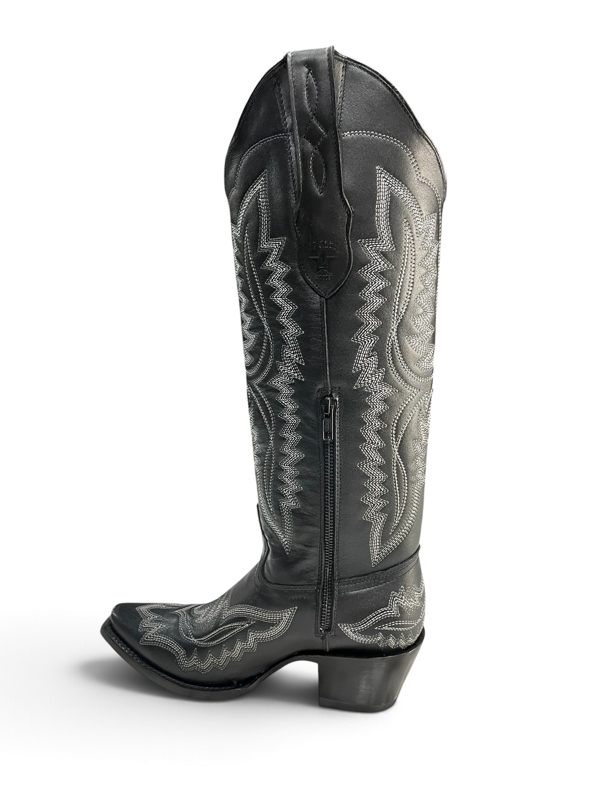 Botas vaqueras Botas El Pistolero PYP de cuero negro con bordado plateado, punta cuadrada y cremallera lateral.