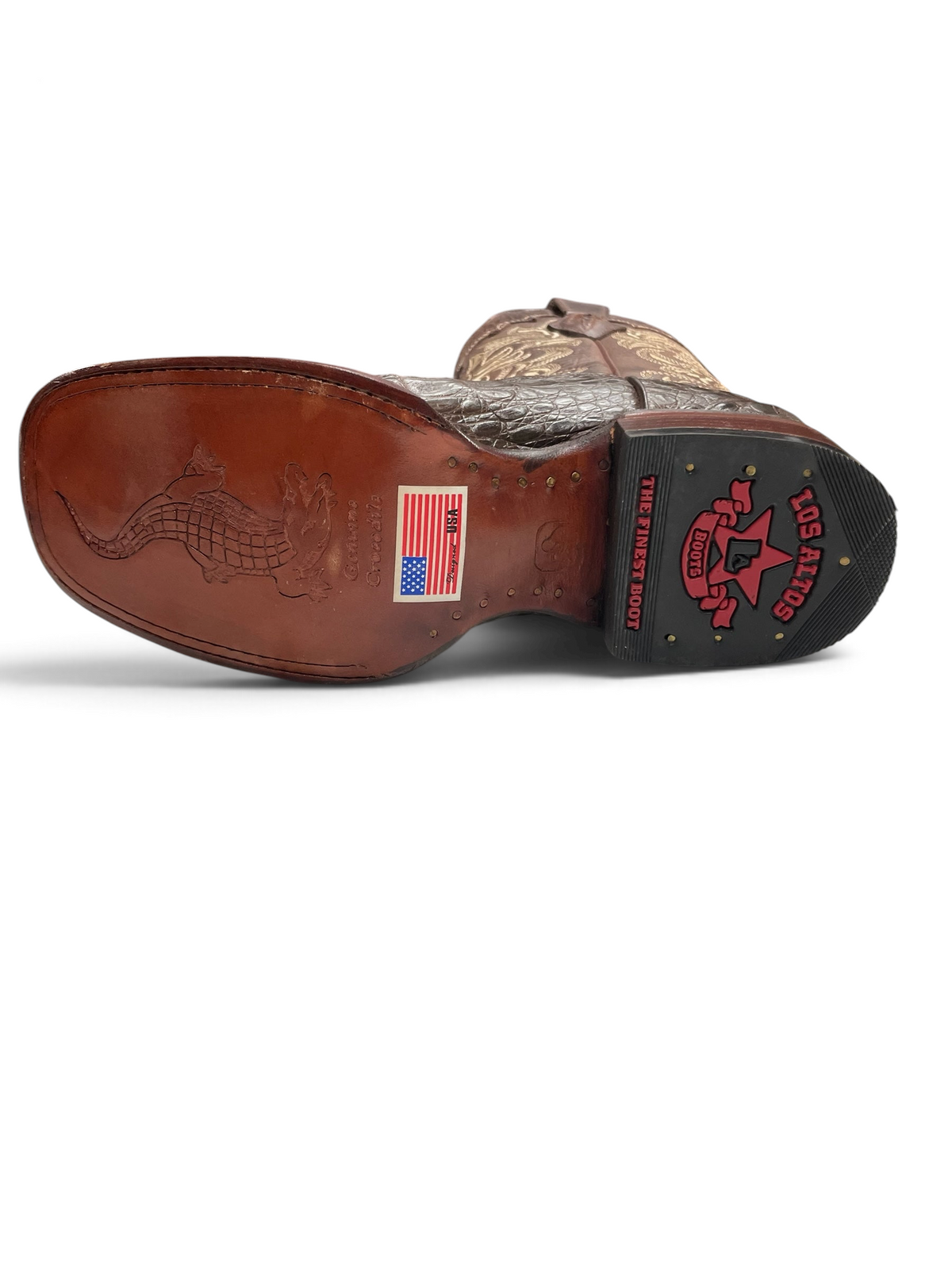 Suela de cuero de Botas El Pistolero PYP con grabado de cocodrilo, tacón con logo y etiqueta de piel genuina
